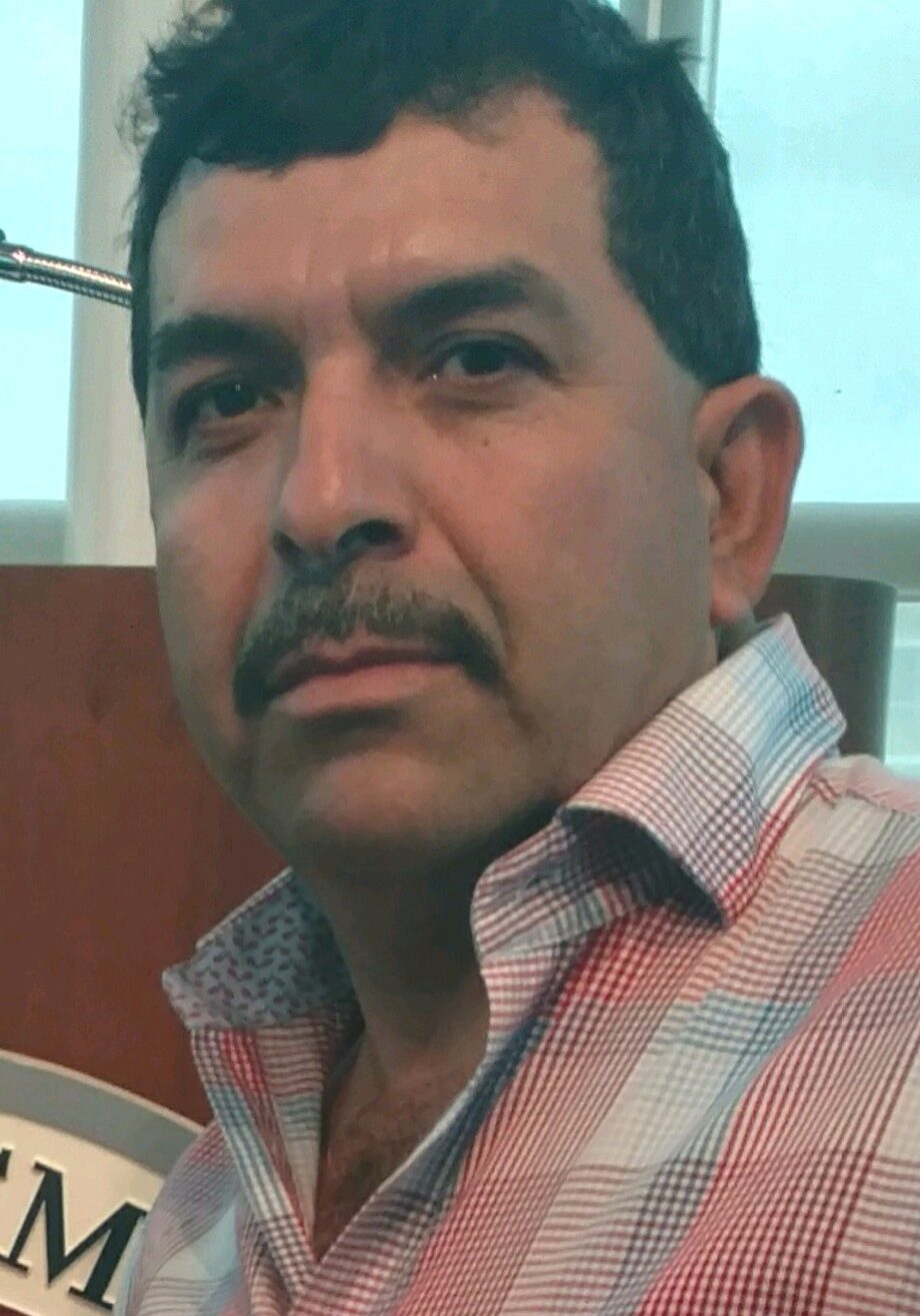 Man with mustache wearing a checkered shirt. Man with mustache wearing a checkered shirt.